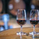 Two-Port-Wine-glasses-against-a-Port-Winery-background-in-Portugal