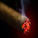 lit cigar smoking up close