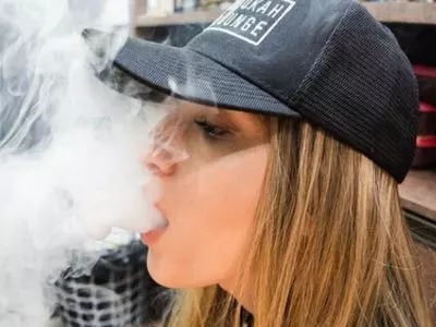 blowing smoke out of mouth