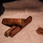 Three cigars sitting on top of each other