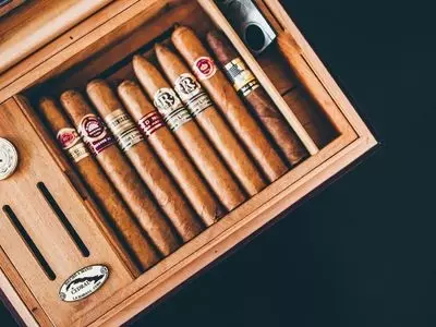 Cigars sitting inside of a humidor